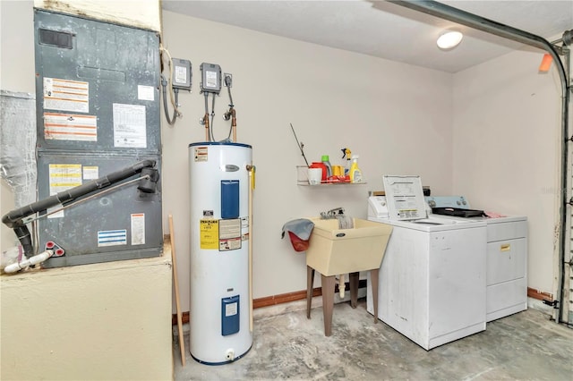 washroom with washing machine and dryer and electric water heater