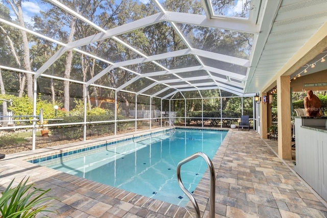 view of pool featuring a patio area and a lanai