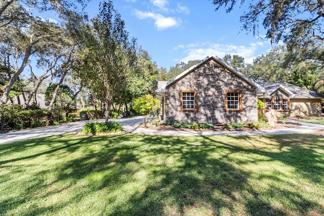 view of property exterior featuring a lawn