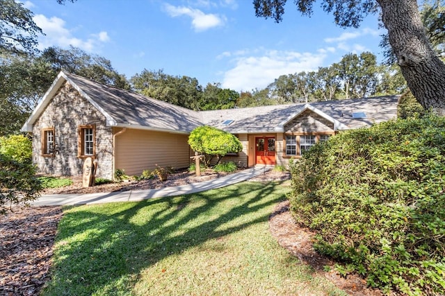 ranch-style home with a front lawn