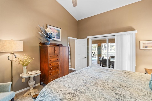 carpeted bedroom featuring access to outside, vaulted ceiling, and ceiling fan