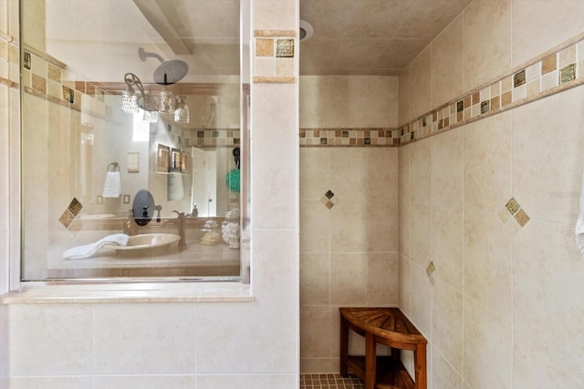 bathroom with walk in shower and tile walls