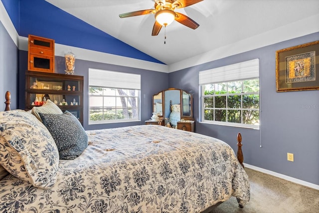 bedroom with ceiling fan, lofted ceiling, carpet floors, and multiple windows