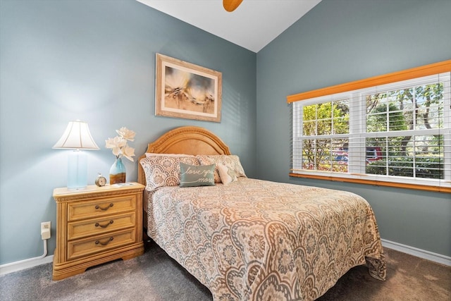 carpeted bedroom with ceiling fan and lofted ceiling