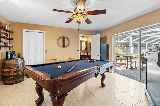 game room with ceiling fan, light tile patterned floors, and billiards