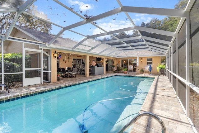 view of pool featuring a patio area and a lanai