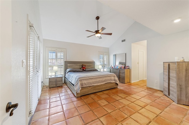 bedroom with ceiling fan, high vaulted ceiling, and light tile patterned floors