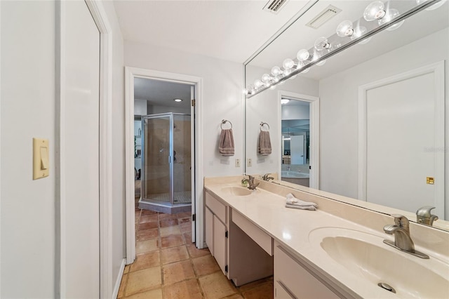 bathroom with vanity and an enclosed shower