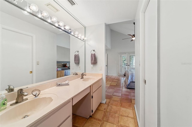 bathroom featuring ceiling fan, french doors, and vanity