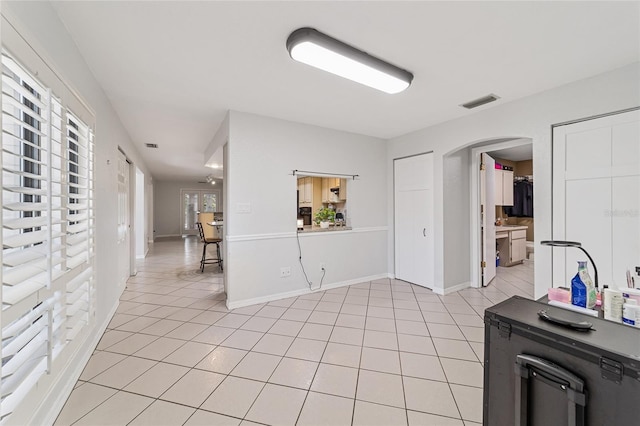 interior space featuring light tile patterned floors