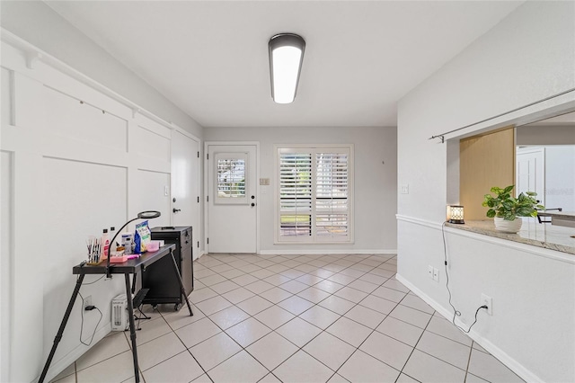 entryway with light tile patterned floors