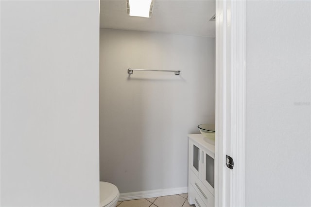 bathroom featuring tile patterned floors and toilet