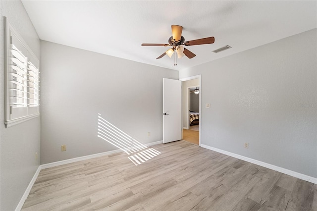 unfurnished room featuring light hardwood / wood-style floors and ceiling fan