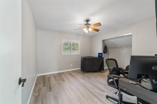 office space with ceiling fan and light hardwood / wood-style floors