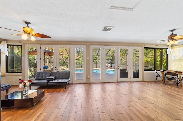 sunroom featuring french doors