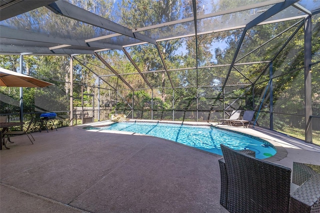 view of pool with a patio and a lanai