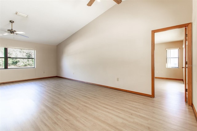 unfurnished room with ceiling fan, light hardwood / wood-style flooring, and high vaulted ceiling