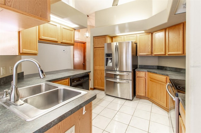 kitchen with sink, light tile patterned floors, stainless steel appliances, and decorative light fixtures