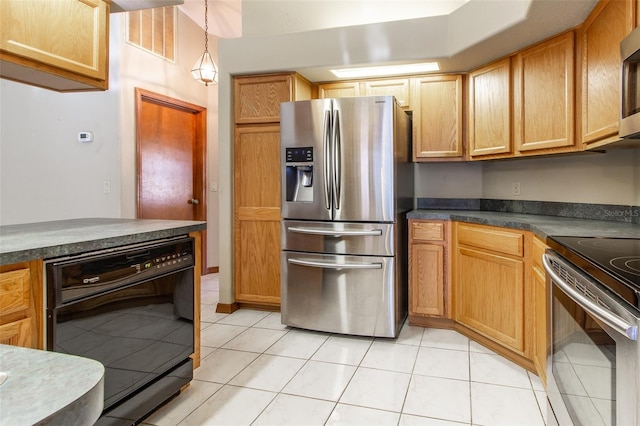 kitchen with light tile patterned floors, pendant lighting, and appliances with stainless steel finishes