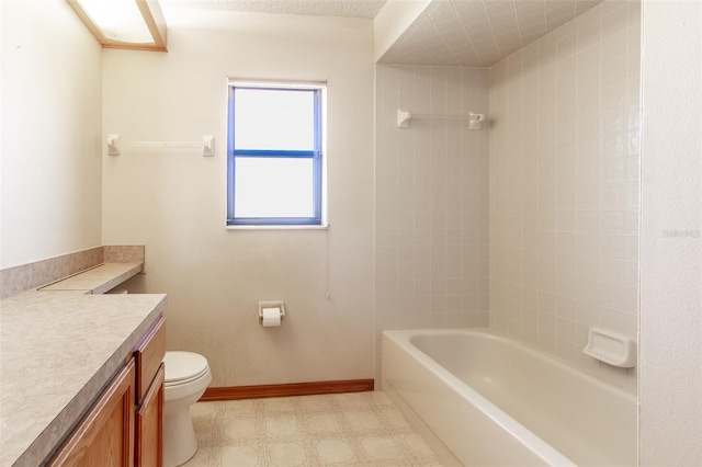 full bathroom with vanity, toilet, and tiled shower / bath