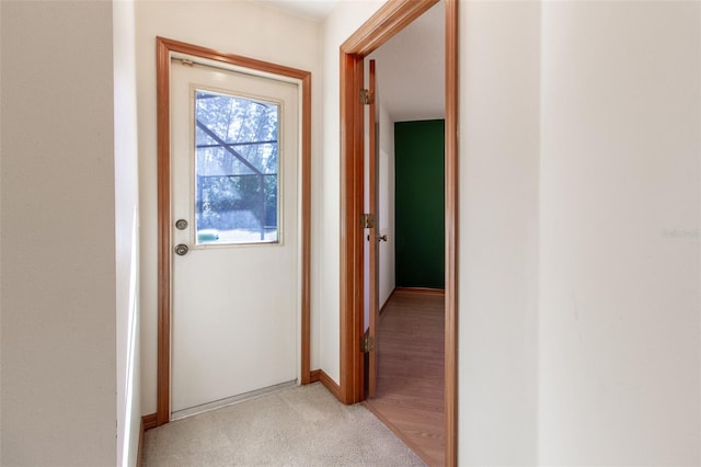 corridor with light wood-type flooring