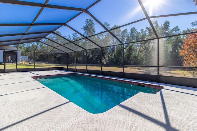 view of pool featuring a lanai and a patio area