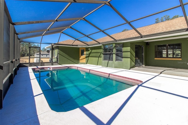 view of pool featuring a lanai and a patio