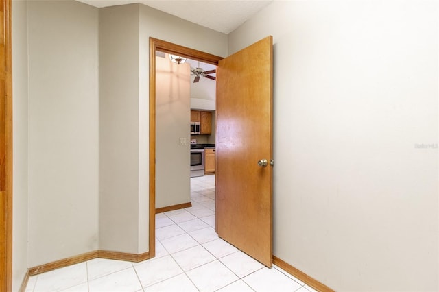 hallway featuring light tile patterned floors