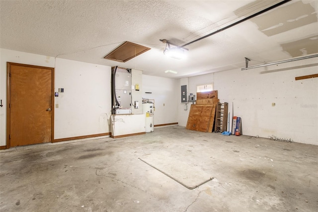 garage featuring heating unit, electric water heater, and electric panel