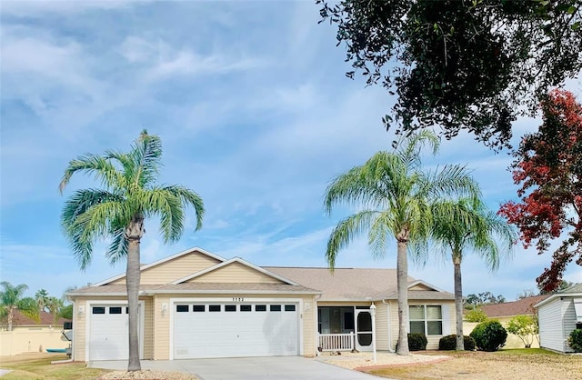 single story home with an attached garage and concrete driveway