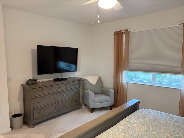 bedroom featuring ceiling fan and light colored carpet