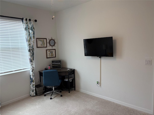 carpeted office space with a wealth of natural light