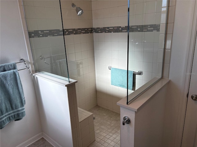 bathroom featuring a tile shower