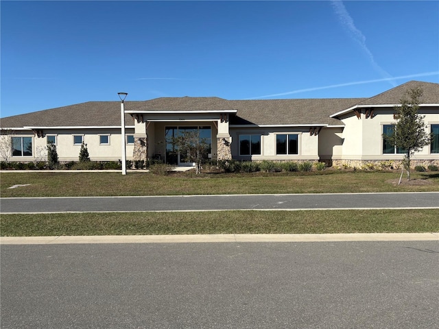 ranch-style house with a front yard