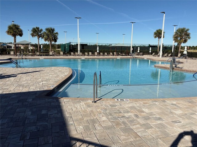 view of swimming pool featuring a patio