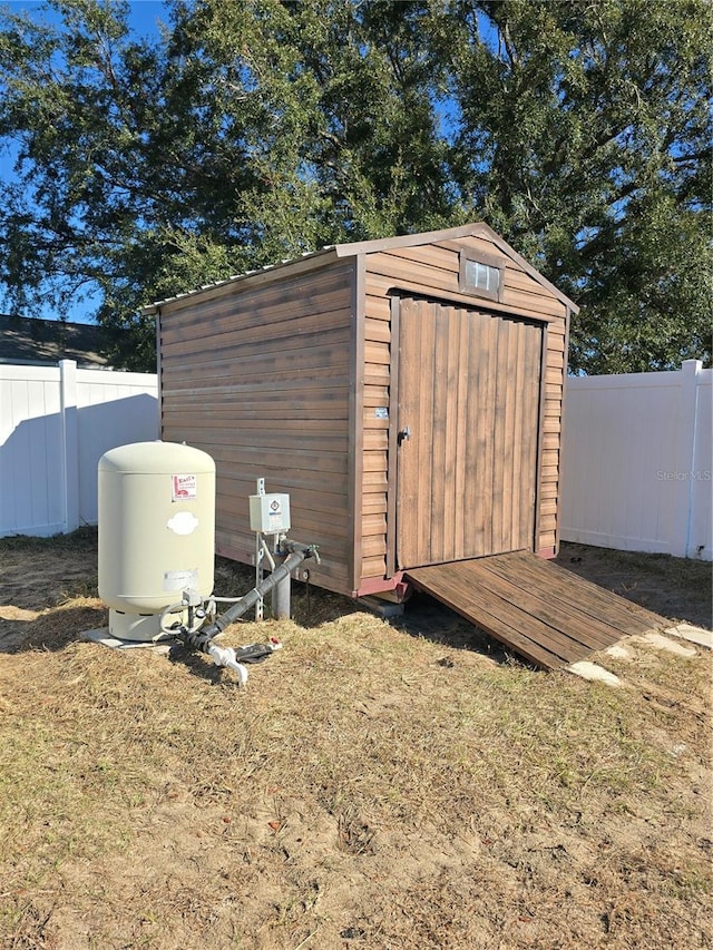 view of outdoor structure featuring a lawn