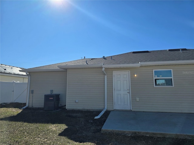 back of house with cooling unit and a patio area