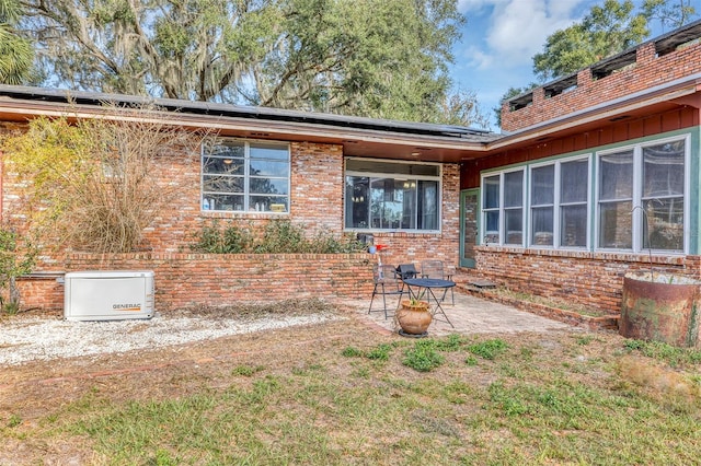 back of property featuring a patio area