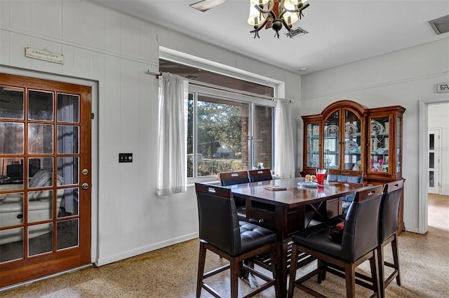 dining space with a chandelier