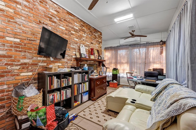 living room featuring ceiling fan, a wall unit AC, and brick wall