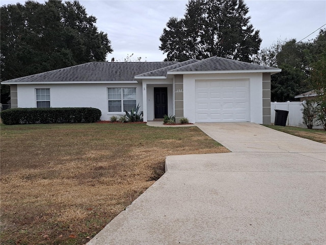 ranch-style house with a front lawn and a garage