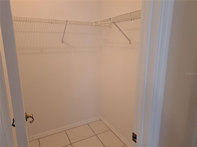 walk in closet featuring tile patterned floors