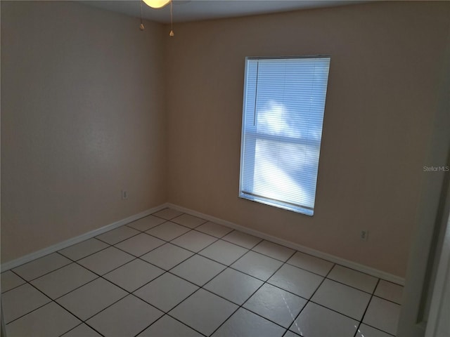 unfurnished room featuring light tile patterned flooring