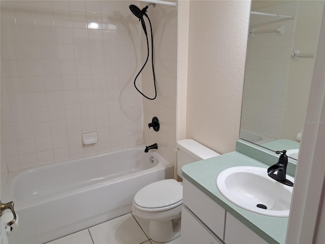 full bathroom with tile patterned floors, toilet, vanity, and tiled shower / bath