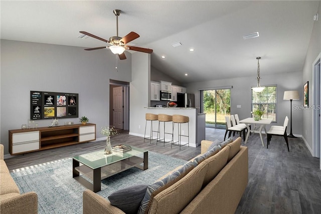 living room featuring ceiling fan, dark hardwood / wood-style flooring, and high vaulted ceiling