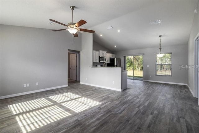 unfurnished living room with dark hardwood / wood-style floors, high vaulted ceiling, and ceiling fan