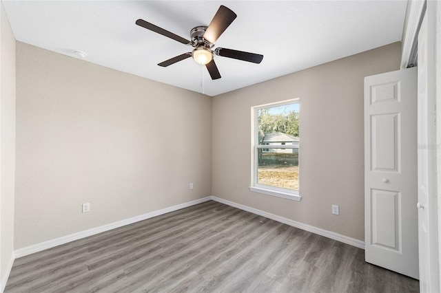 unfurnished room with light hardwood / wood-style floors and ceiling fan