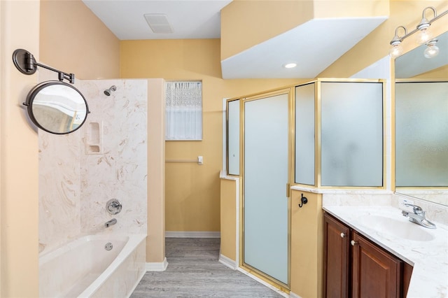 bathroom featuring wood-type flooring, vanity, and separate shower and tub