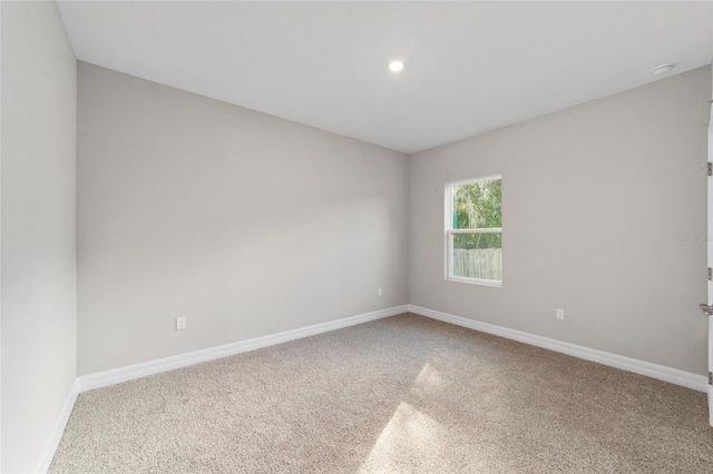 empty room with carpet flooring