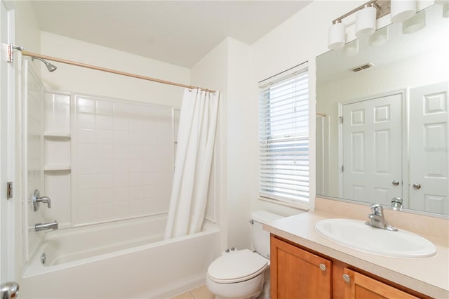 full bathroom with vanity, toilet, and shower / bath combo